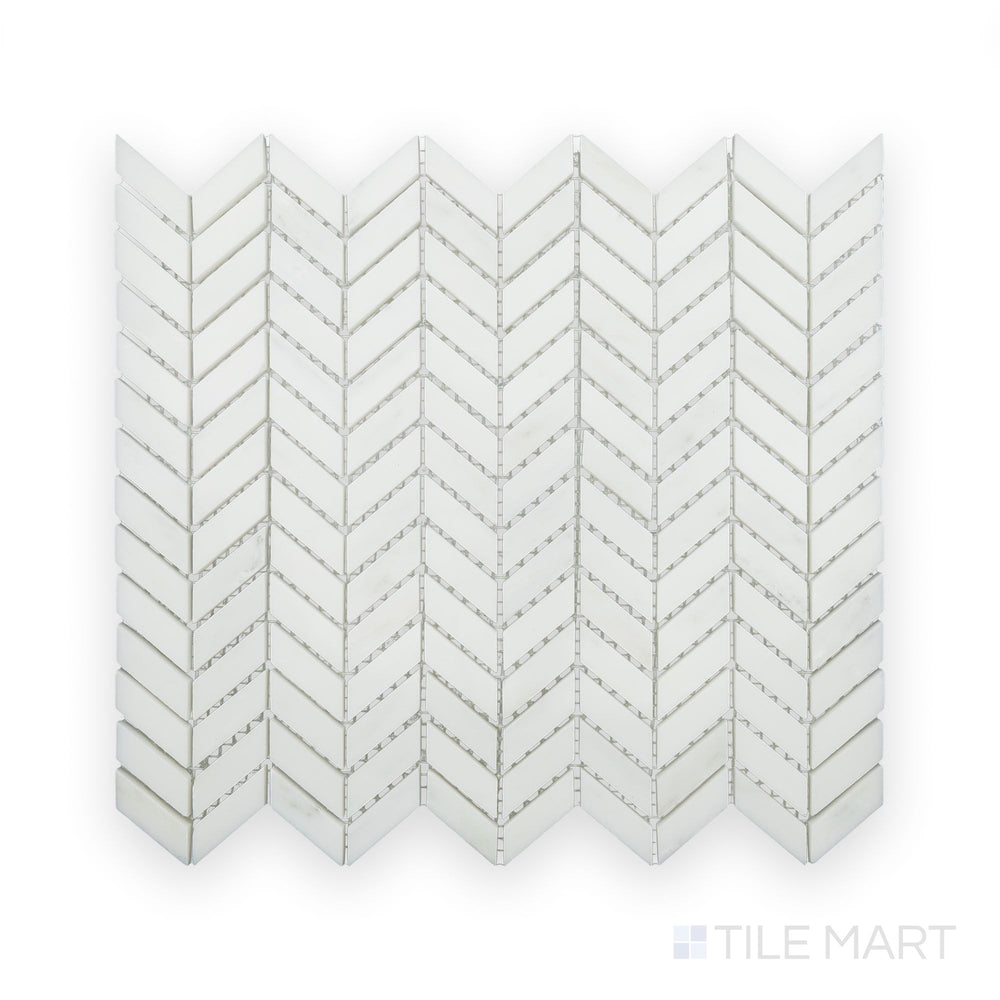 A sharp close-up of Oriental White Marble Mini Chevron Polished Mosaic, showcasing its intricate V-shaped pattern with a glossy surface.
