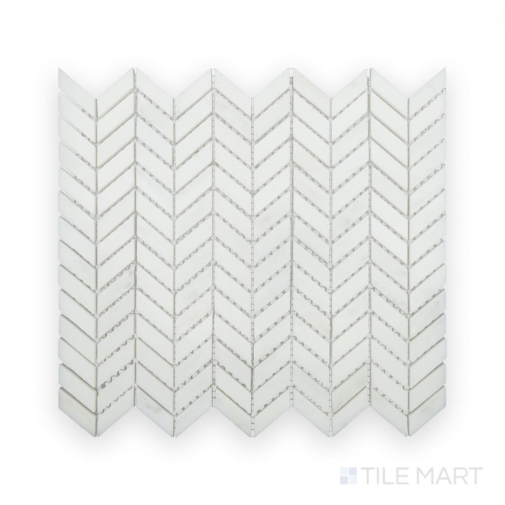 A sharp close-up of Oriental White Marble Mini Chevron Polished Mosaic, showcasing its intricate V-shaped pattern with a glossy surface.