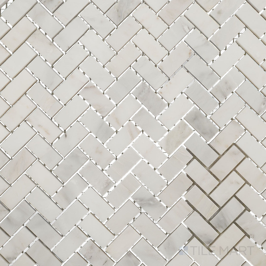 Overhead image of Oriental White Marble 5/8x1-1/4 herringbone polished mosaic, featuring a refined herringbone pattern with a glossy, polished surface.