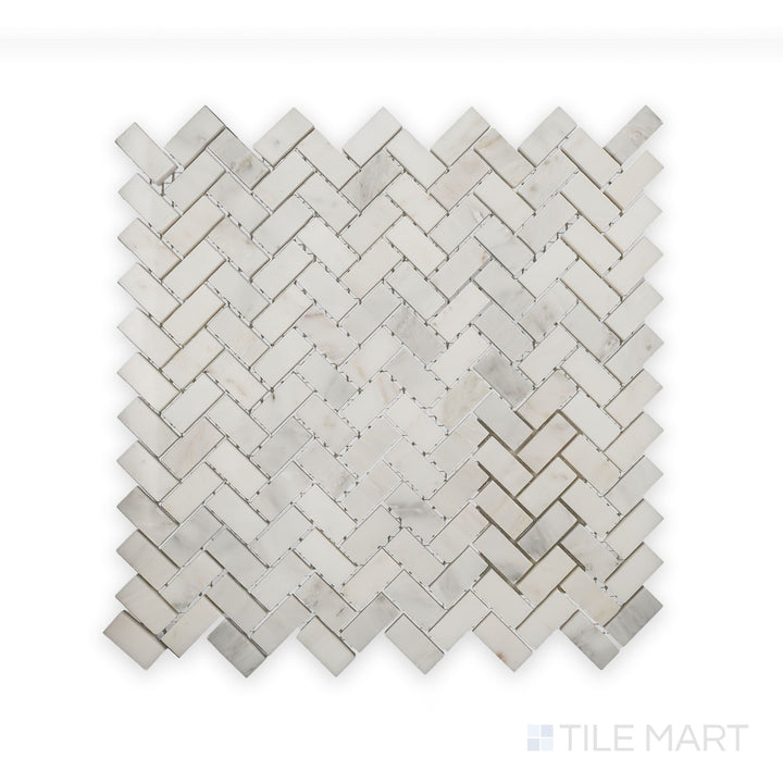 A finely detailed look at Oriental White Marble 5/8X1-1/4 Herringbone Polished Mosaic, featuring a smooth surface and crisp, interwoven layout.