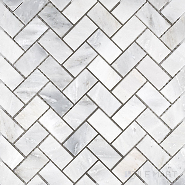 Flat-lay shot of Oriental White Marble 1x2 herringbone honed mosaic, displaying an elongated herringbone pattern with a soft honed finish.