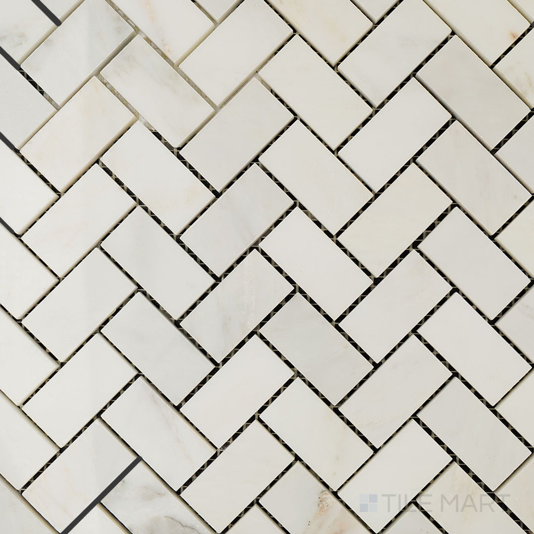 Top-down view of Oriental White Marble 1x2 herringbone polished mosaic, featuring an elegant herringbone pattern with a glossy, reflective surface.