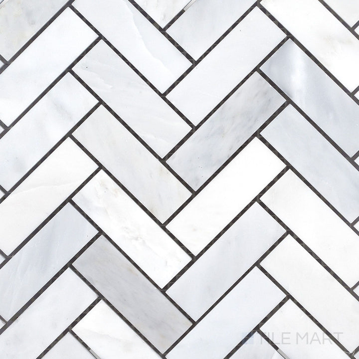 Overhead image of Oriental White Marble 1x3 herringbone honed mosaic, showcasing an elongated herringbone pattern with a smooth honed finish.