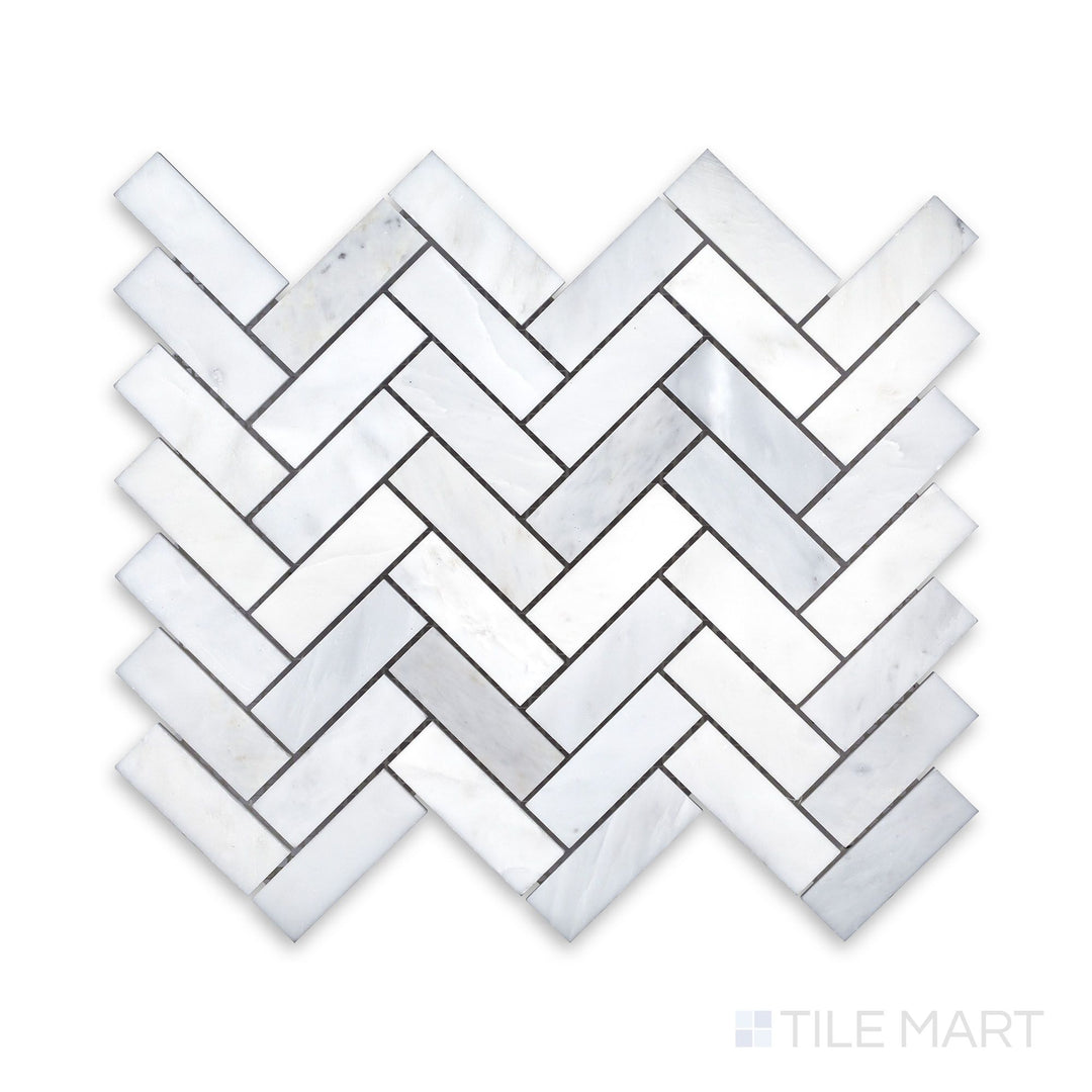 An up-close perspective of Oriental White Marble 1X3 Herringbone Honed Mosaic, showcasing the natural stone details in a dynamic arrangement.