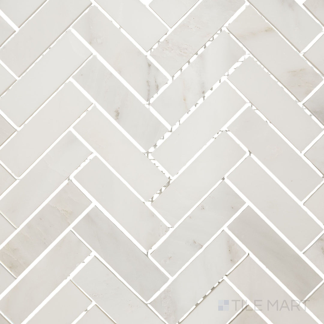 Flat-lay shot of Oriental White Marble 1x3 herringbone polished mosaic, displaying a sleek herringbone layout with a refined polished texture.