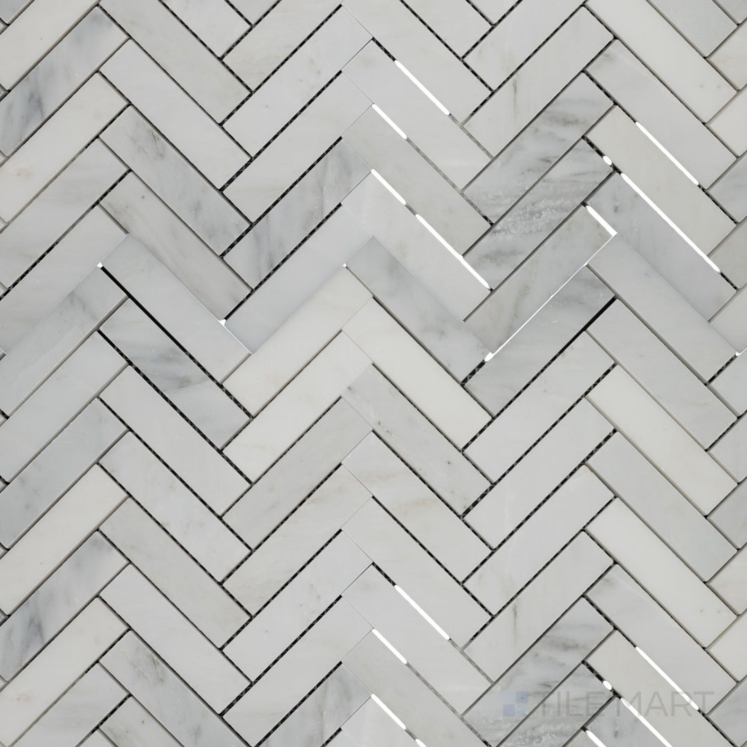 Top-view photo of Oriental White Marble 1x4 herringbone honed mosaic, featuring a dynamic herringbone design with a soft honed surface.