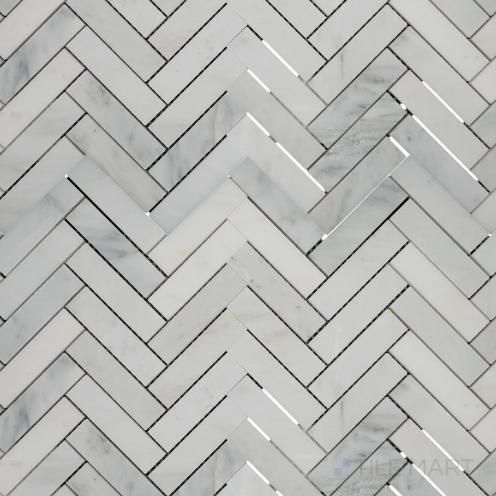 Top-view photo of Oriental White Marble 1x4 herringbone honed mosaic, featuring a dynamic herringbone design with a soft honed surface.