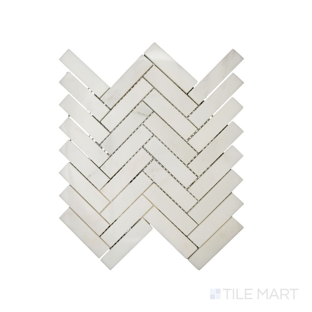 Up-close shot of Oriental White Marble 1X4 Herringbone Polished Mosaic, bringing out its smooth finish and clean, symmetrical alignment.