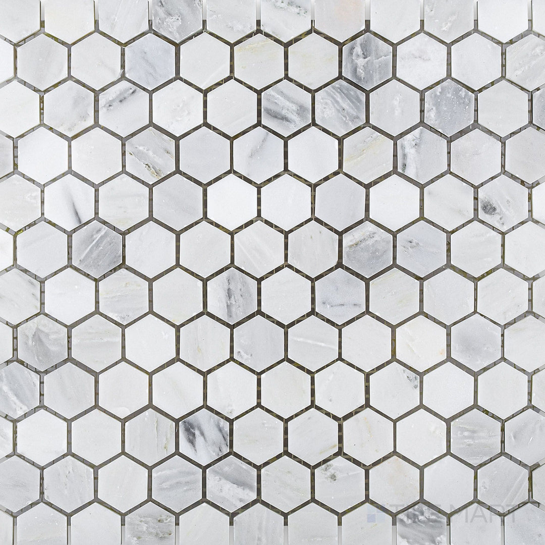 Flat-lay shot of Oriental White Marble 1" hexagon honed mosaic, featuring a geometric hexagonal arrangement with a smooth honed surface.