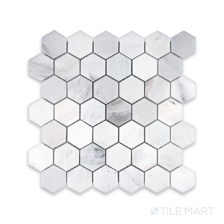 Zoomed-in detail of Oriental White Marble 2" Hexagon Honed Mosaic, emphasizing its soft texture and precise stonework.