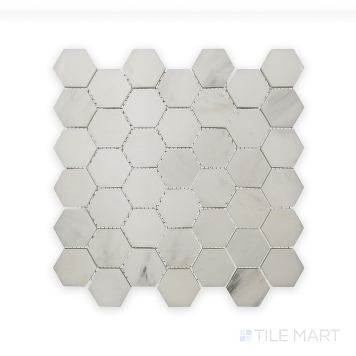 A refined close-up of Oriental White Marble 2" Hexagon Polished Mosaic, highlighting the seamless pattern and smooth finish.