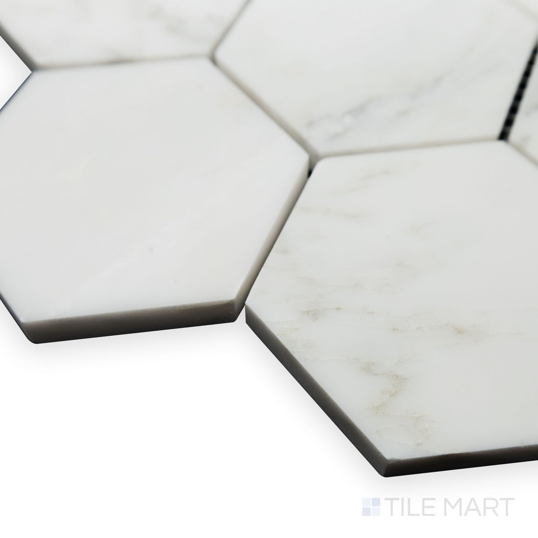A structured design takes center stage in this angled corner perspective of Oriental White Marble 3" Hexagon honed mosaic, where its matte texture adds depth.