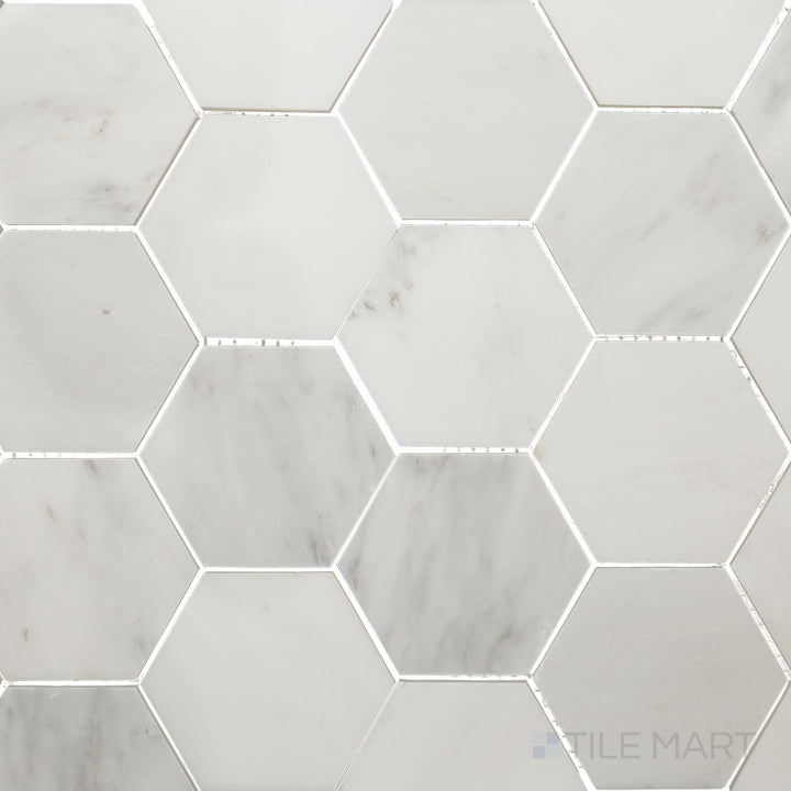 Overhead image of Oriental White Marble 3" hexagon polished mosaic, featuring a luxurious polished surface that accentuates the white and grey veining.