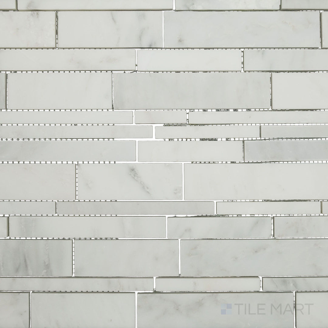 Flat-lay shot of Oriental White Marble linear honed mosaic, showcasing a sleek linear design with a smooth matte finish.