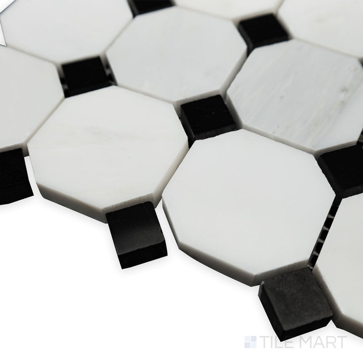 From a bright corner angle, the Oriental White Marble Octagon with Negro Marquina polished mosaic gleams with a luxurious polished finish and striking contrast.