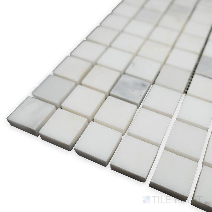 A matte elegance is revealed in this corner shot of Oriental White Marble 1" Square honed mosaic, where the soft honed finish complements the clean square pattern.