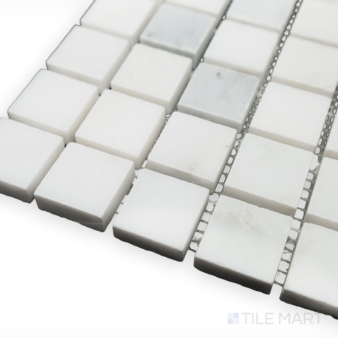 A polished and crisp aesthetic is captured in this angled corner shot of Oriental White Marble 1" Square polished mosaic, reflecting a modern yet timeless appeal.