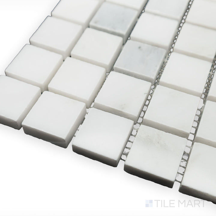 A polished and crisp aesthetic is captured in this angled corner shot of Oriental White Marble 1" Square polished mosaic, reflecting a modern yet timeless appeal.