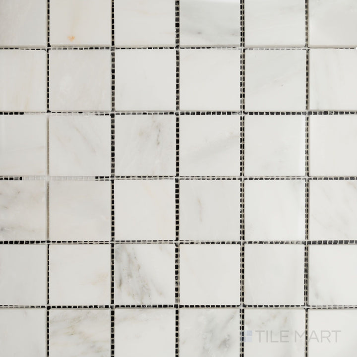 Overhead image of Oriental White Marble 2" square polished mosaic, featuring a glossy surface that enhances its sophisticated square layout.