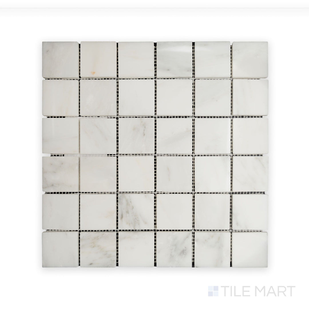 Close-up perspective of Oriental White Marble 2" Square Polished Mosaic, featuring crisp edges and a polished, luminous surface.