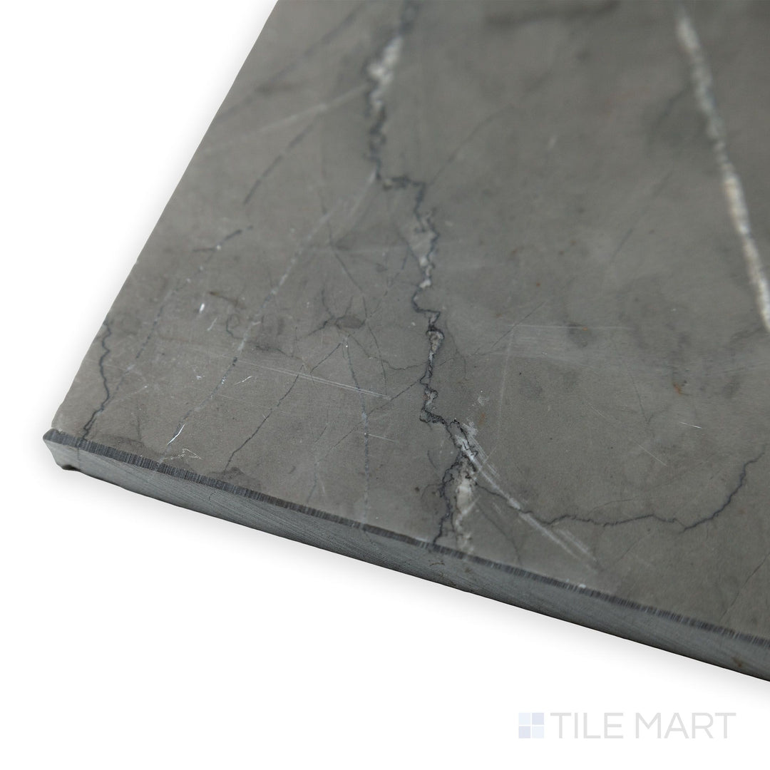 From a side corner angle, the Graphite Marble 12x24 honed tile reveals its deep gray tones and soft, non-reflective surface, perfect for modern interiors.