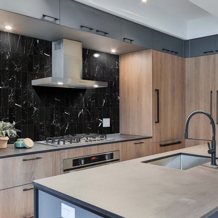 A bold black honed marble tile with delicate veining creates a dramatic and luxurious atmosphere, making Negro Marquina Marble 3x6 honed a striking choice.