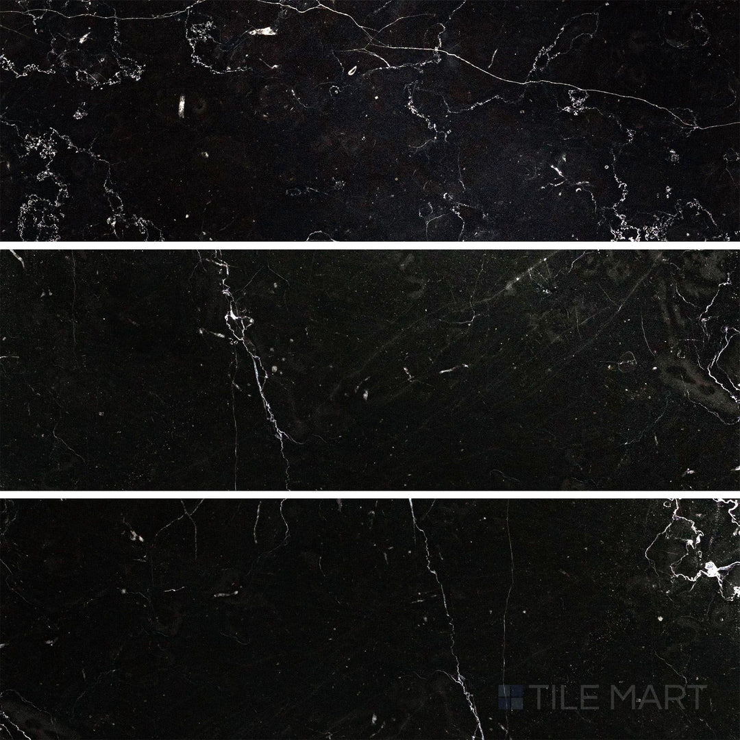 Flat-lay shot of Negro Marquina Marble 4x12 polished tile, featuring a reflective surface that highlights the marble’s bold white veining.