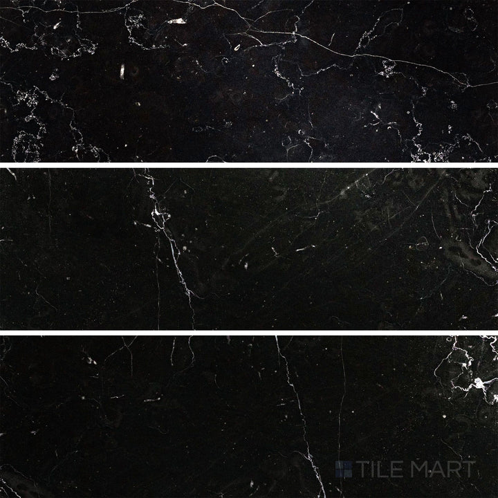 Flat-lay shot of Negro Marquina Marble 4x12 polished tile, featuring a reflective surface that highlights the marble’s bold white veining.