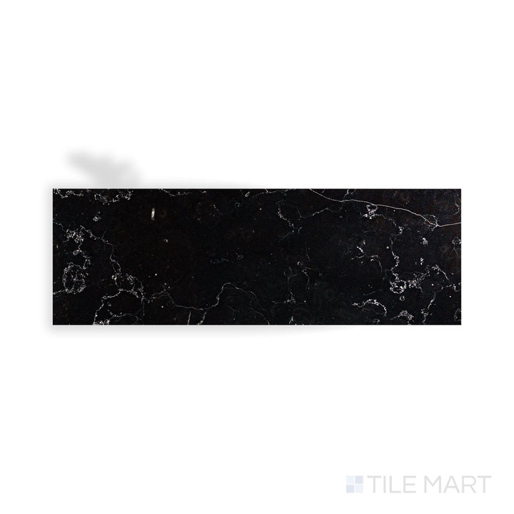An intricate look at Negro Marquina Marble 4X12 Polished Tile, highlighting its deep black hue with a mirror-like surface.