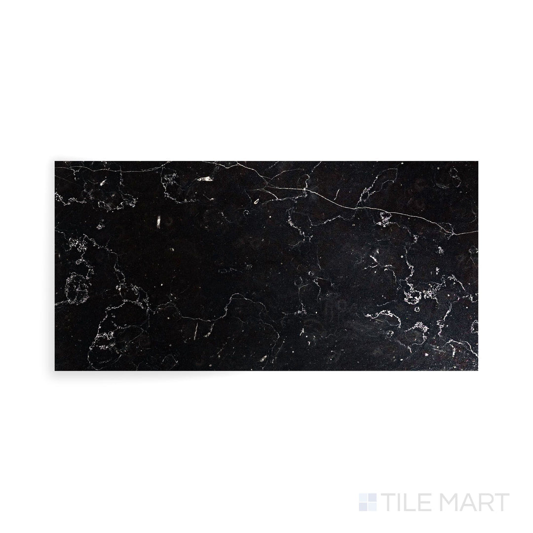 Close-up capture of Negro Marquina Marble 6X12 Polished Tile, showcasing a refined black base with high-contrast white veins.