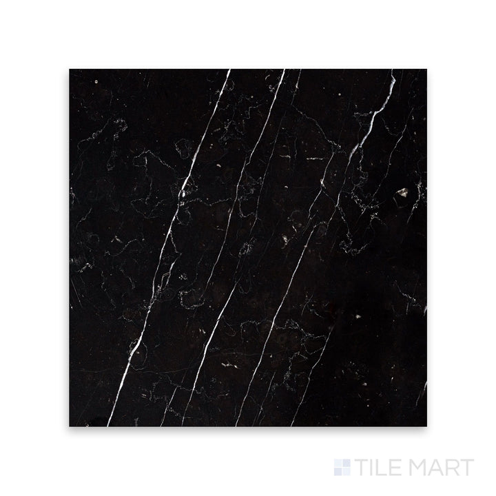 A sharp close-up of Negro Marquina Marble 12X12 Honed Tile, featuring a sophisticated, non-reflective finish with a deep black tone.
