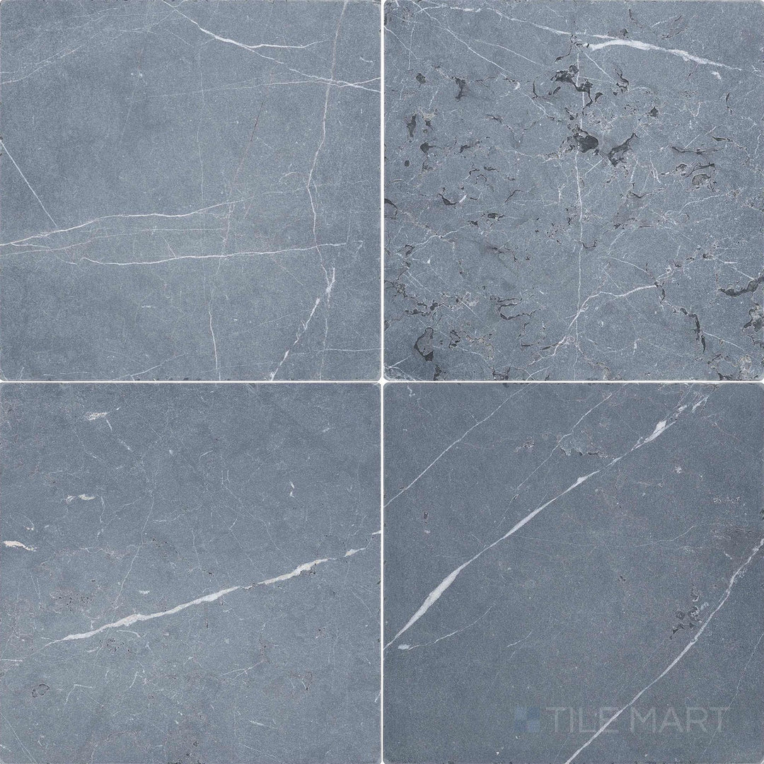 Top-down view of Negro Marquina Marble 12x12 tumbled tile, featuring a rustic surface with softened edges and natural veining.