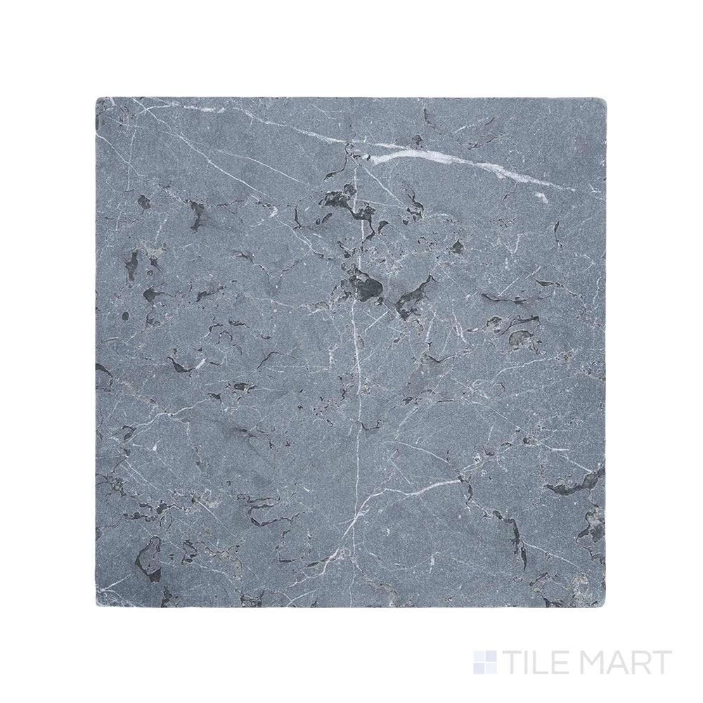 Close-up of Negro Marquina Marble 12X12 Tumbled Tile, presenting a textured, weathered surface that enhances its natural appeal.