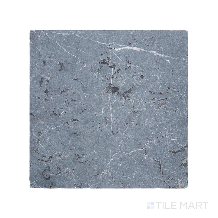 Close-up of Negro Marquina Marble 12X12 Tumbled Tile, presenting a textured, weathered surface that enhances its natural appeal.