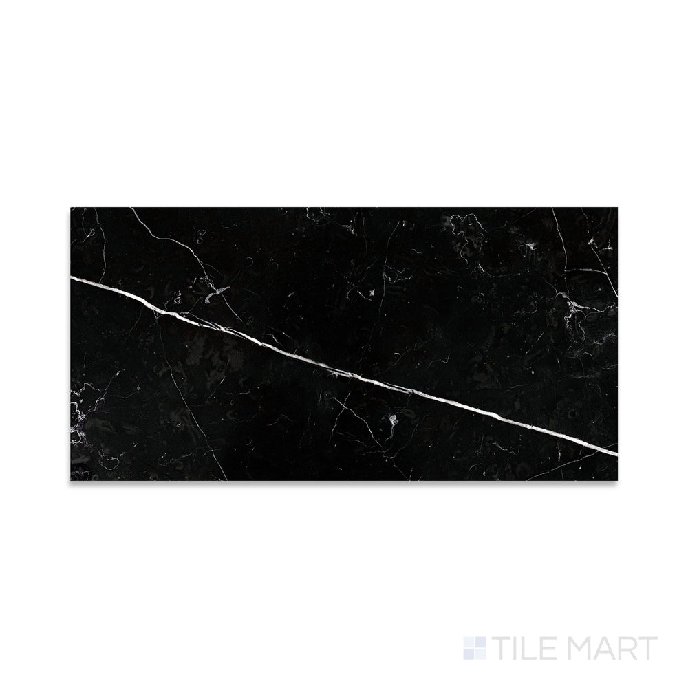 Close-up of Negro Marquina Marble 12X24 Honed Tile, featuring a deep black surface with a soft, matte finish and striking white veining.