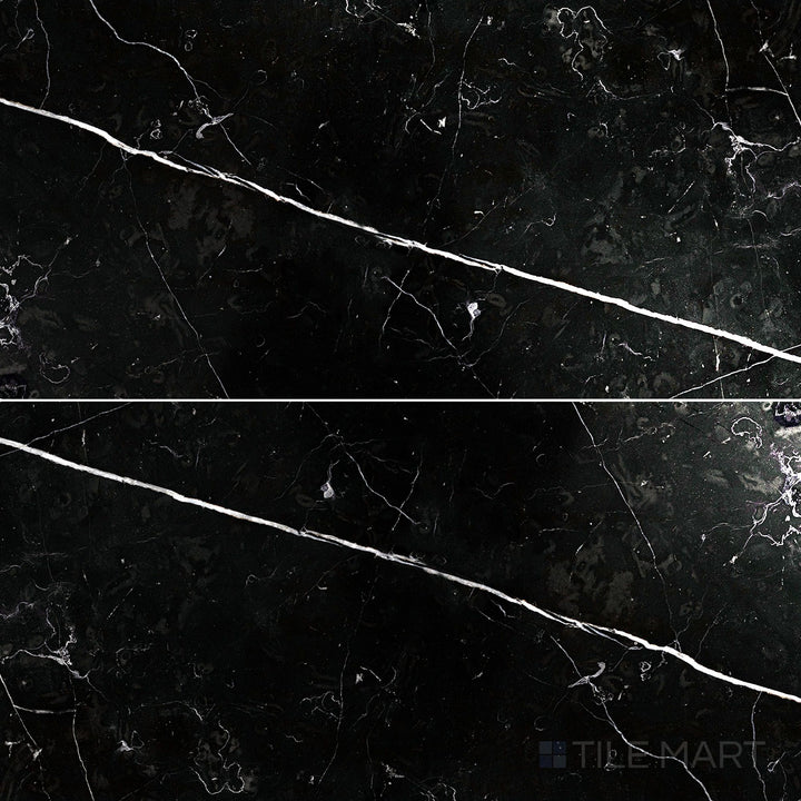 Flat-lay shot of Negro Marquina Marble 12x24 polished tile, featuring a glossy surface that enhances its deep black tones and striking white veining.