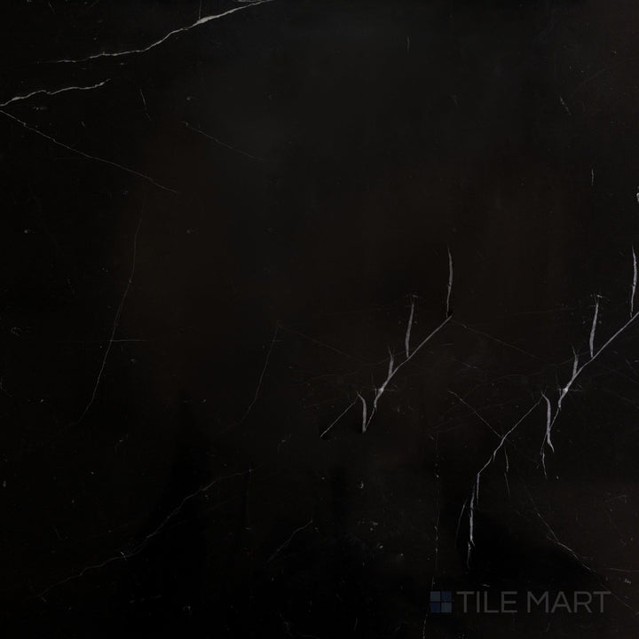 Top-down view of Negro Marquina Marble 24x24 polished tile, offering a smooth reflective finish that enhances its deep black color.