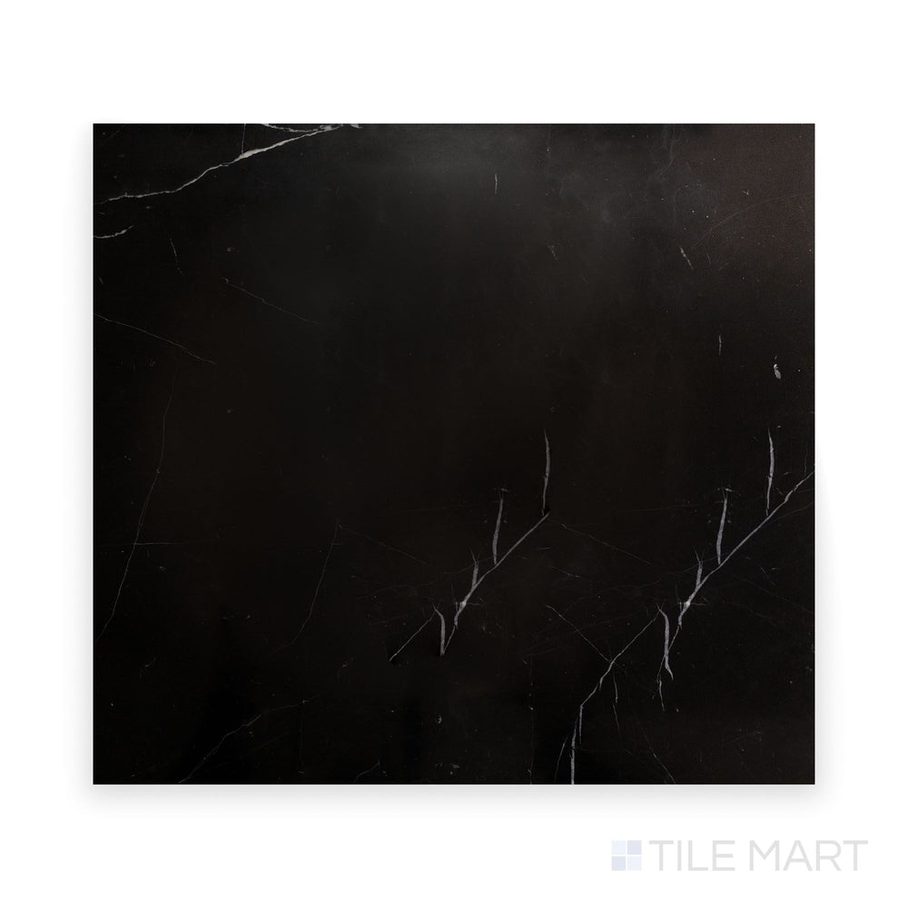 Close-up of Negro Marquina Marble 24X24 Polished Tile, offering an elegant high-gloss black surface with striking white streaks.