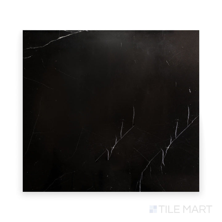 Close-up of Negro Marquina Marble 24X24 Polished Tile, offering an elegant high-gloss black surface with striking white streaks.
