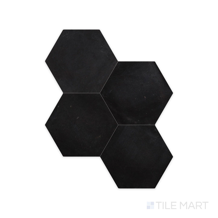A sharp close-up of Negro Marquina Marble 6" Hexagon Honed Tile, showcasing its smooth, matte finish with distinct veining.