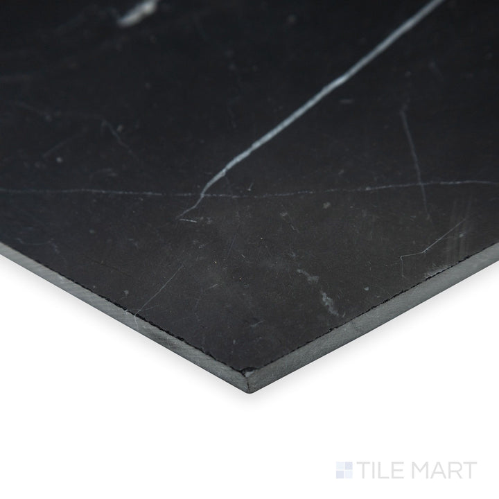 A precise hexagonal layout stands out in this angled corner shot of Negro Marquina Marble 6" hexagon honed tile, where the matte finish adds an understated elegance.