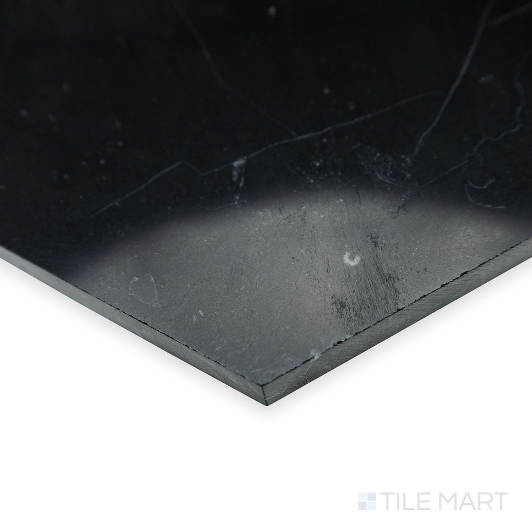 From a polished perspective, the glossy surface of Negro Marquina Marble 6" hexagon polished tile shines in this corner shot, adding depth to its geometric design.