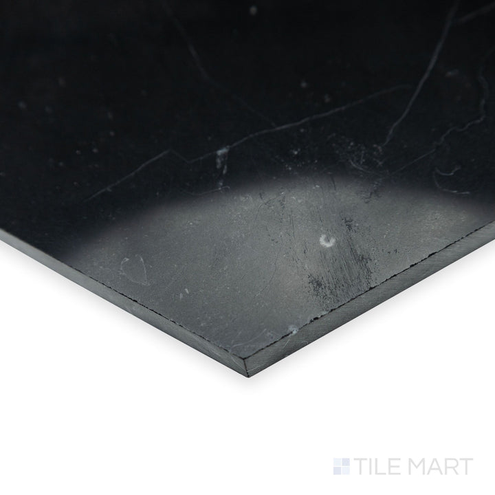 From a polished perspective, the glossy surface of Negro Marquina Marble 6" hexagon polished tile shines in this corner shot, adding depth to its geometric design.