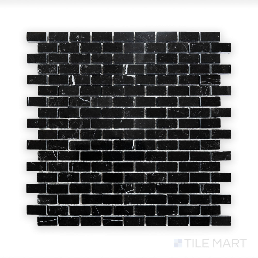 Close-up of Negro Marquina Marble 5/8X1-1/4 Brick Polished Mosaic, featuring a sleek finish with naturally contrasting white veins.