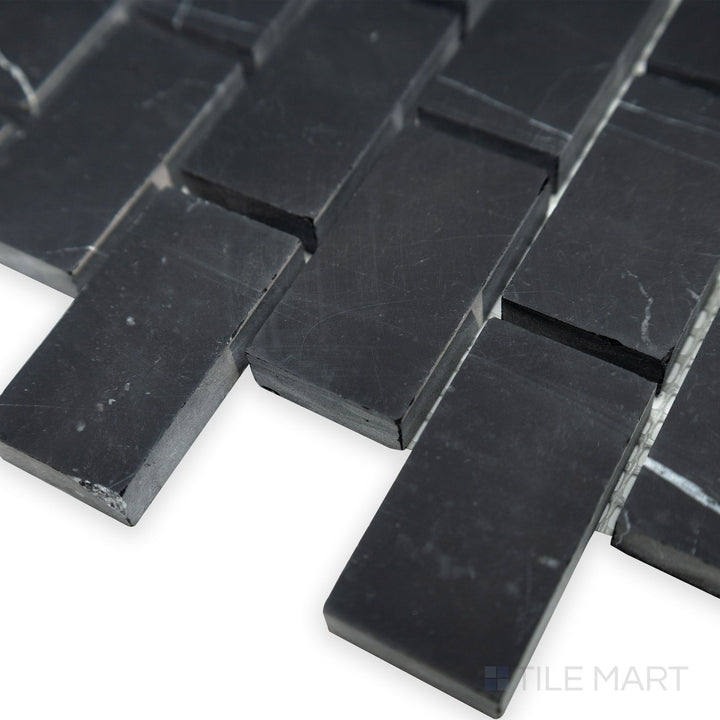 A classic brick arrangement is captured in this close-up corner shot of Negro Marquina Marble 1x2 brick honed mosaic, enhancing its natural stone texture.