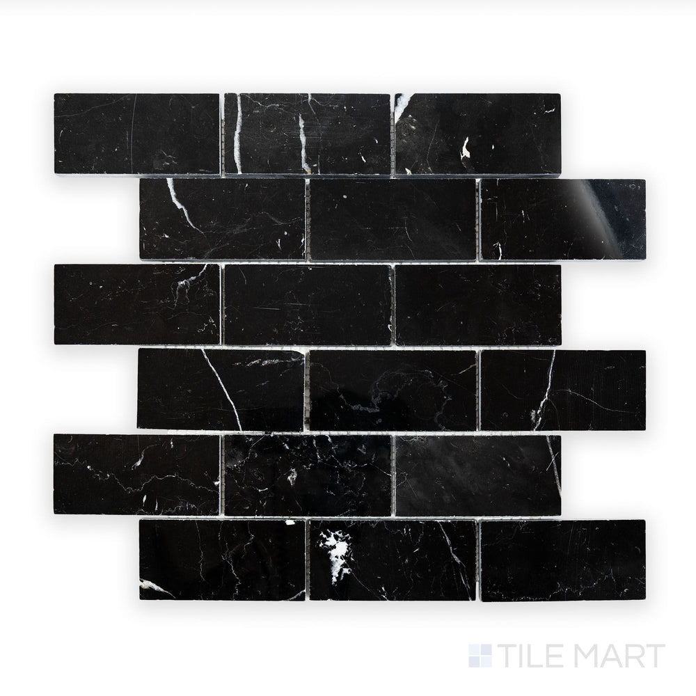 Detailed view of Negro Marquina Marble 2X4 Brick Polished Mosaic, showcasing a sleek black surface with a reflective sheen.