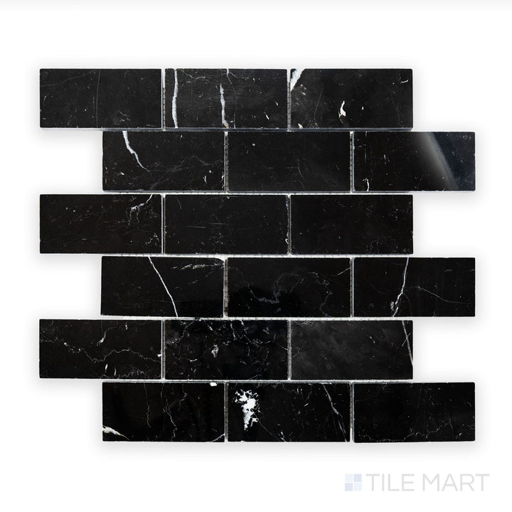 Detailed view of Negro Marquina Marble 2X4 Brick Polished Mosaic, showcasing a sleek black surface with a reflective sheen.