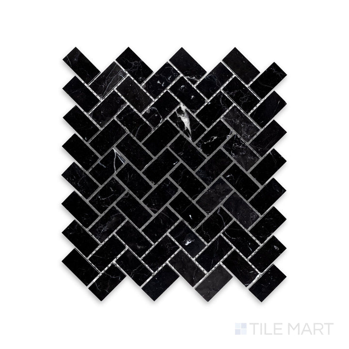 A zoomed-in look at Negro Marquina Marble 1X2 Herringbone Honed Mosaic, highlighting the bold veining and smooth matte texture.
