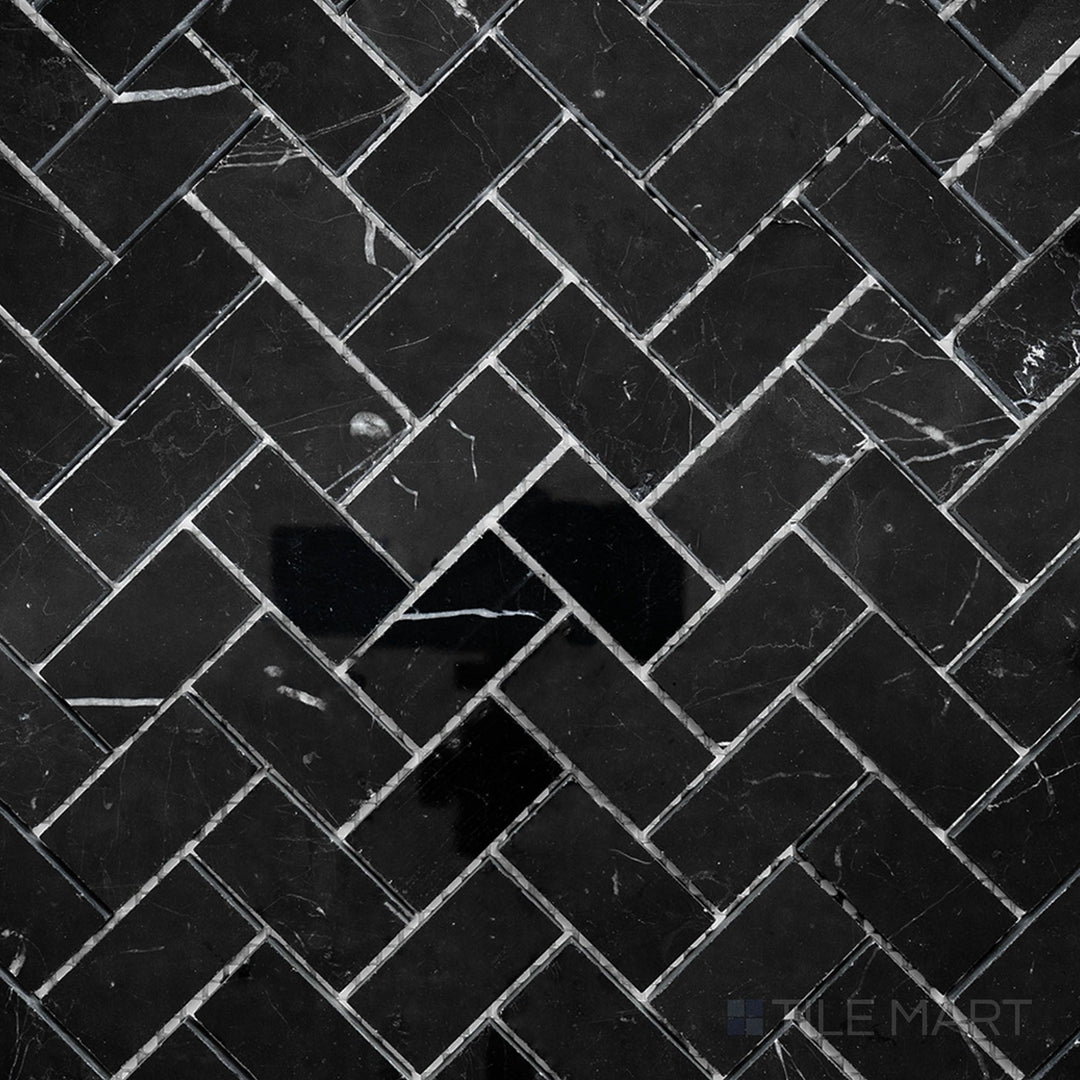 Overhead image of Negro Marquina Marble 1x2 herringbone polished mosaic, showcasing a glossy herringbone pattern that enhances the rich black tones.