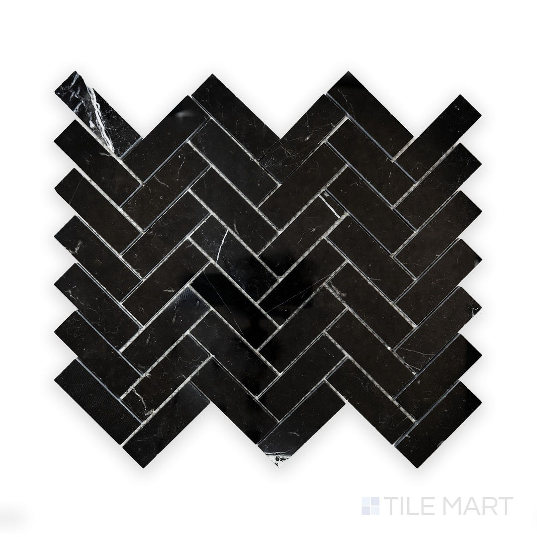 A close-up look at Negro Marquina Marble 1X3 Herringbone Polished Mosaic, showcasing crisp white veining against a deep black polished background.